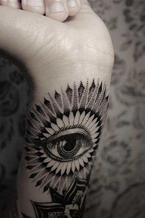 Black dot’s eye tattoo