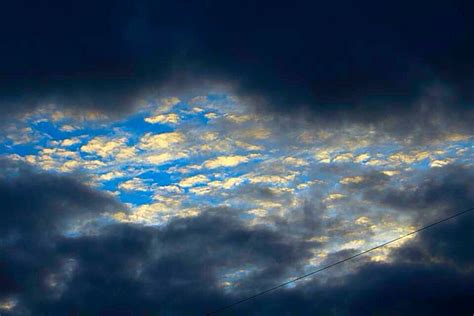 A break in the rain clouds- the sun shone through | Amazing photography, Clouds, Rain clouds