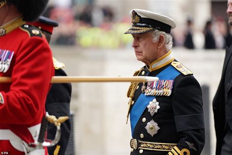 Tearful King Charles III stares at the Queen's coffin during funeral ...