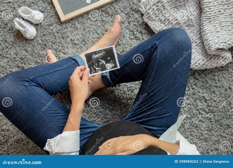 Pregnant Woman Holding an Ultrasound Image of the Baby in Utero, Young Mother Expecting a Baby ...