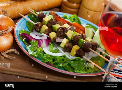 Fried chicken hearts on skewers Stock Photo - Alamy