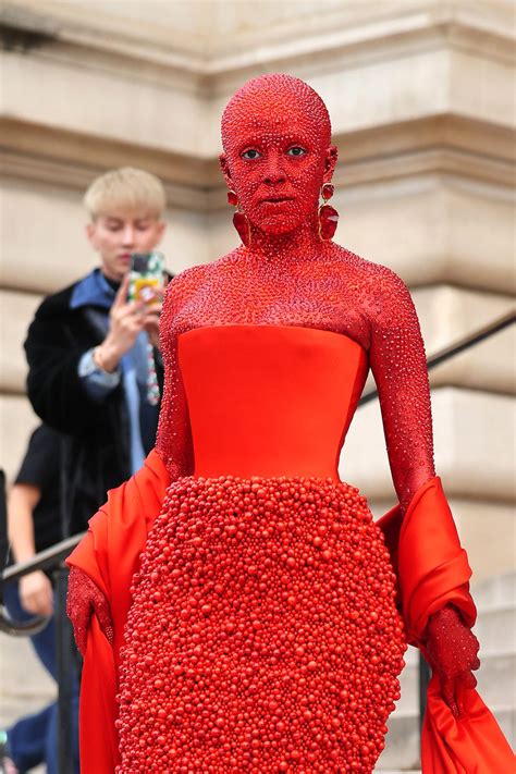 Doja Cat covered herself in red body paint and 30,000 crystals for Schiaparelli's Paris Fashion ...