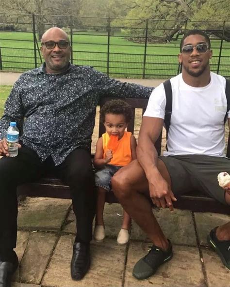 'Three generations strong': Anthony Joshua pictured alongside dad Robert and young son Joseph ...