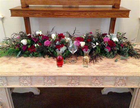 Beautiful flower arrangement for a December wedding in the chapel ...