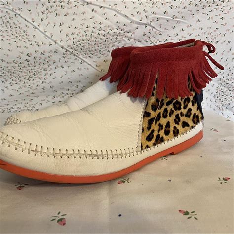 Minnetonka moccasins, white with red fringe and... - Depop