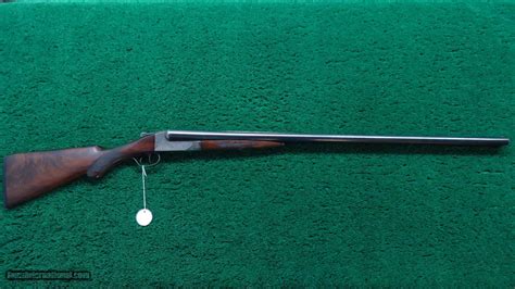 ITHACA DOUBLE BARRELED HAMMERLESS SHOTGUN