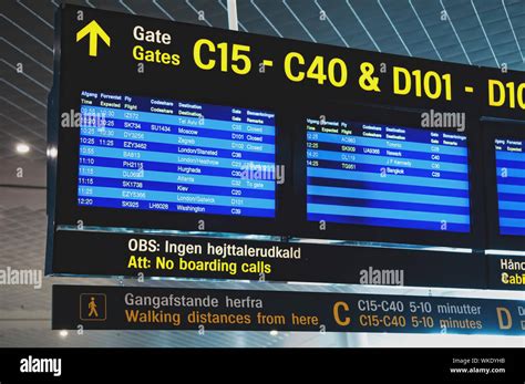 Flight information arrival departure board showing destinations, time ...