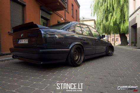 Tuning BMW 530i E34 with wide steel wheels and wing, rear