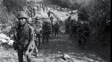 ARVN troops move up Route 9 in Laos as part of Operation Lam Son 719. Circa February 1971. [1932 ...