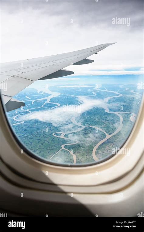 view from jet plane window on land, beautiful look on river Stock Photo ...