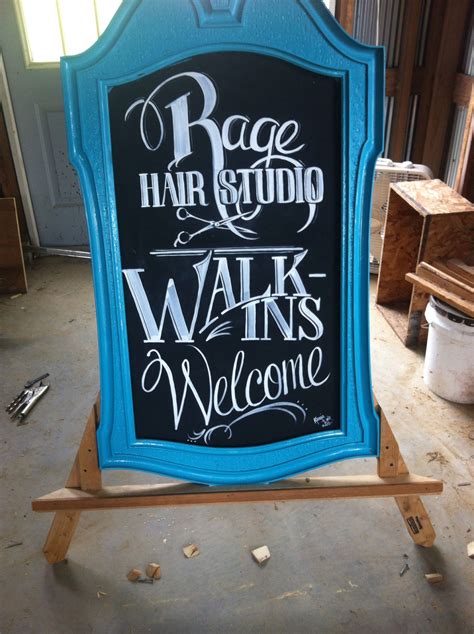 Old mirror turned sidewalk sign. Hair salon. Advertising. From trash to treasure. A frame ...