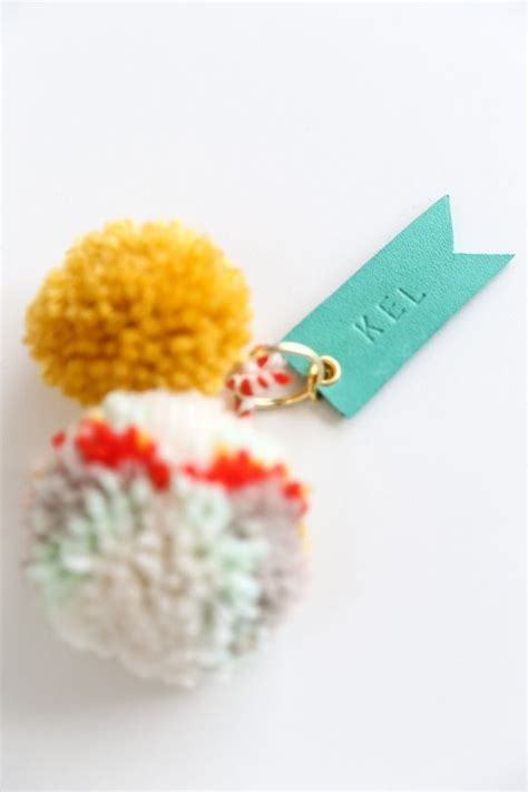 DIY pom pom & leather luggage tags Diy Pom Pom, Craft Stick Crafts ...