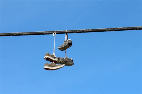 Why Do People Throw Shoes on Power Lines? 9 Theories Explained