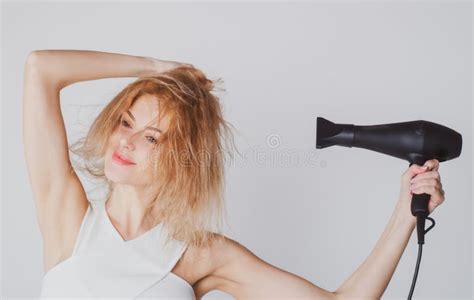 Beautiful Girl Blow Drying Her Hair, Hairdryer. Young Woman with Drying Hair with Hair Dry ...