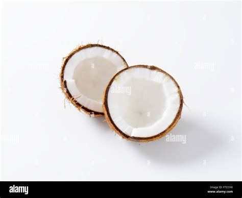 Fresh coconut cut in half Stock Photo - Alamy