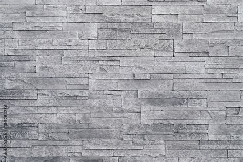 Grey stone wall background. Stacked stone tiles are often used in ...