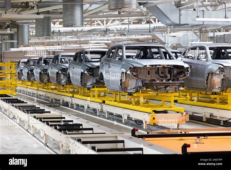 Photo of automobile production line. Modern car assembly plant. Modern ...