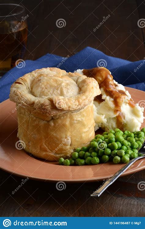 Closeup Pub Meat Pie with Vegetables and Gravy Stock Image - Image of casserole, potato: 144196487