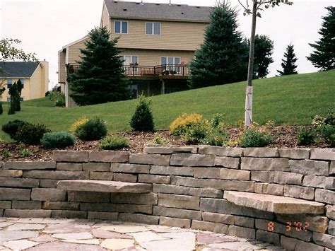 Large Stone Retaining Wall with Patio and Sitting Stones | Oasis ...