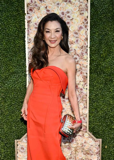 Michelle Yeoh Wore a Stunning Red-Orange Dress to the 2024 Golden Globes