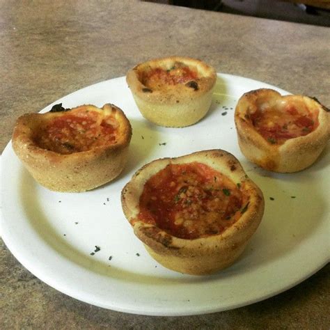 Mini Deep Dish Pizza. Made in a muffin tin. Whole milk mozzarella cheese first, then sausage or ...