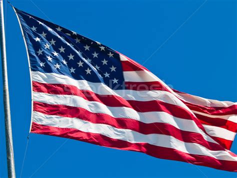 American Flag Waving Proudly on a Clear Windy Day stock photo © Frank ...