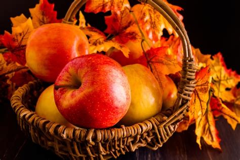 Premium Photo | Bunch of organic red apples in wicker basket.