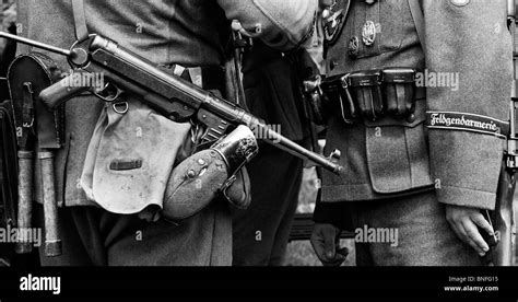 WW2 German army soldier with officer carrying MP40 9 mm submachine gun ...