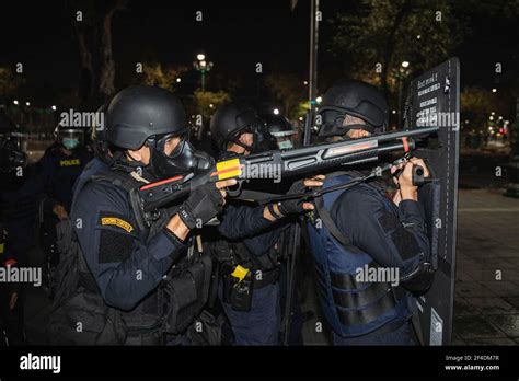 Riot police aims rubber bullet gun during the demonstration. 1.The anti ...