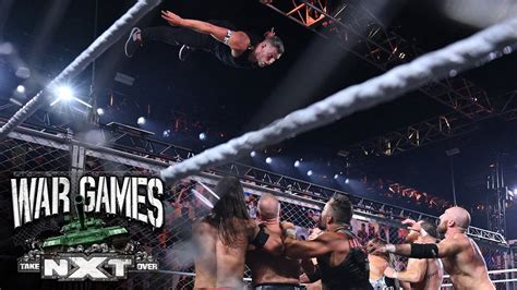 McAfee soars off the cage and takes out the field: NXT TakeOver: WarGames (WWE Network Exclusive ...