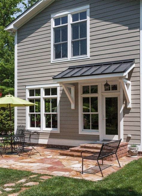 PORCH ROOF DESIGNS AND STYLES | Metal door awning, Garage trellis, Awning over door