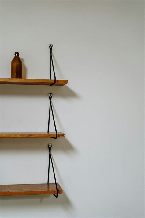 Brown Wooden Wall Mounted Rack · Free Stock Photo