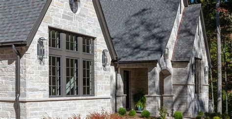 Luxury country natural stone veneer dream home facade front yard exterior Buechel Stone