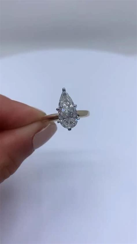 Solitaire pear shaped diamond engagement ring [Video] in 2020 | Diamond ...