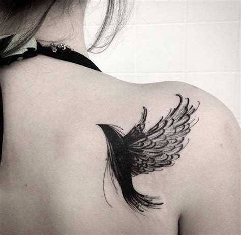 black colored bird sketch tattoo design on shoulder blade for women ...