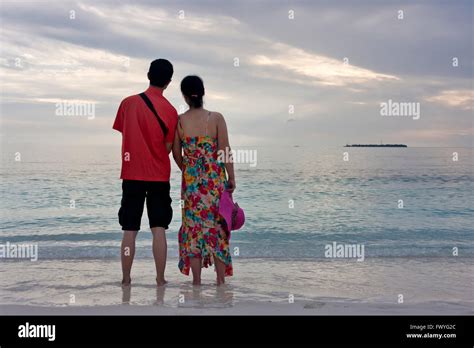 A couple on the beach, Maldives Stock Photo - Alamy