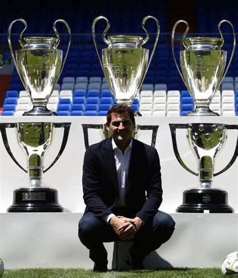 Iker Casillas poses with the trophies he won with Real Madrid after a ...