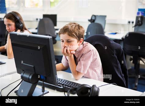 Students using computer in classroom Stock Photo - Alamy