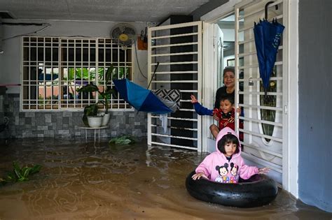 At least four dead, thousands evacuated in Malaysia floods