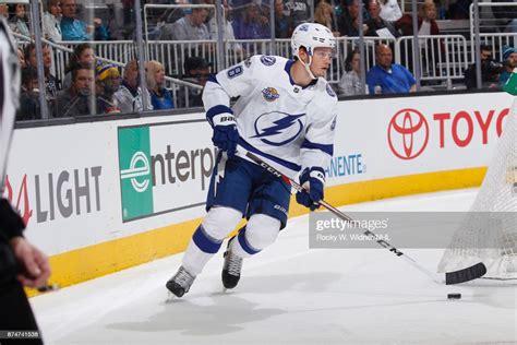 Mikhail Sergachev of the Tampa Bay Lightning skates with the puck ...