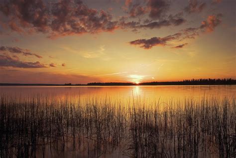 Sunset On A Lake Photograph by Philippe Widling / Design Pics - Fine Art America