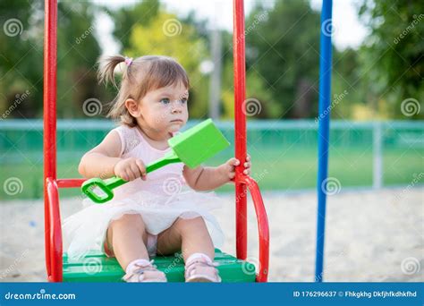 Cute Toddler Girl Playing in Sand on Outdoor Playground. Beautiful Baby ...