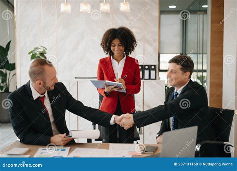 Business People Shaking Hands during a Meeting in Modern Office Stock Photo - Image of together ...