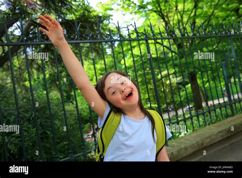 Portrait of little girl smiling outside Stock Photo - Alamy