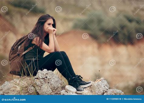 Sad Woman Sitting on a Rocky Cliff Terrified of Heights Stock Photo - Image of camper, cliff ...