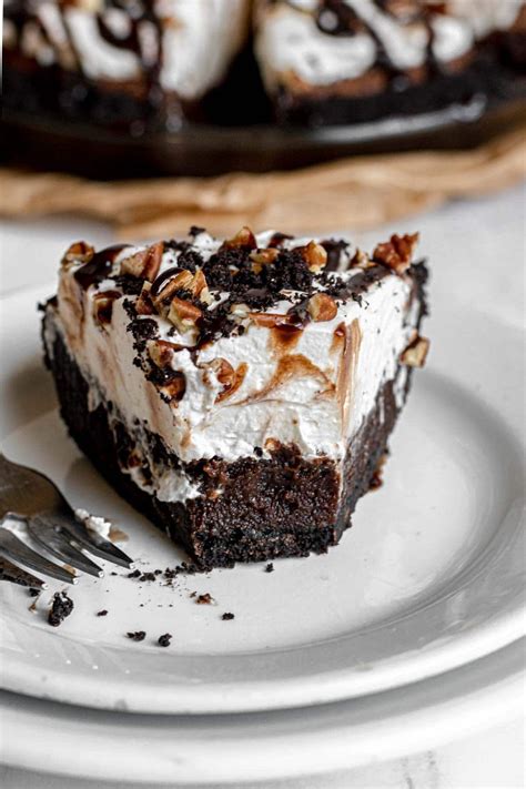 Mississippi Mud Pie is a delicious dessert made with Oreo crust, gooey chocolate filling, and a ...