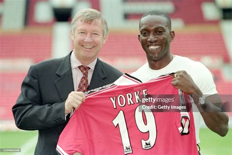 Dwight Yorke is unveiled as a Manchester United player with manager ...