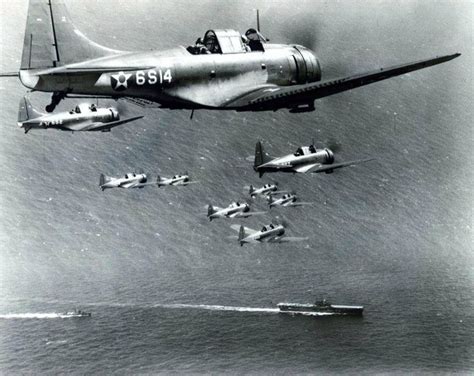 SBD “Dauntless” Dive Bombers, of Scouting Squadron SIX, over USS Enterprise (CV 6), 27 October ...