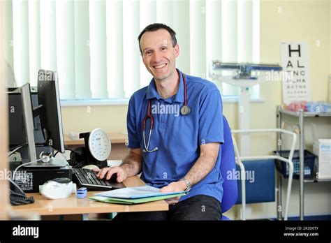 A NHS GP Doctor pictured in his general surgery. North Devon England UK Stock Photo - Alamy