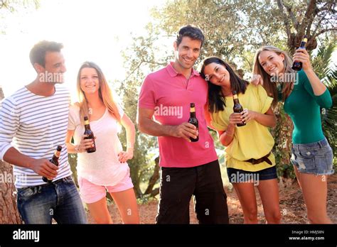 Young people drinking beer Stock Photo - Alamy